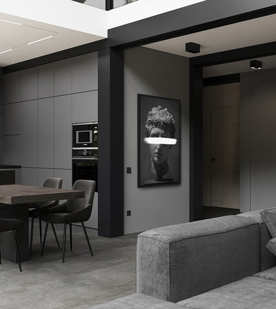 Subtraction room mockup: monochrome classical head with a white bar across the eyes, shown on a wall between a dining area and sofa.
