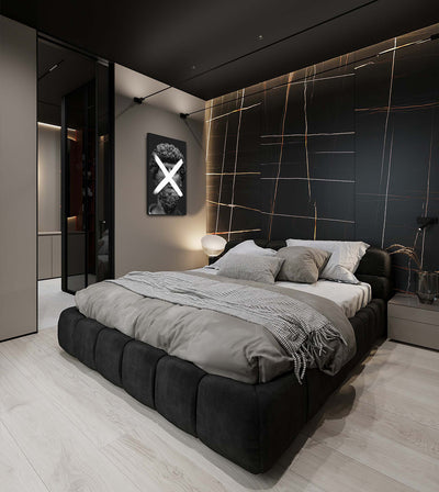 Multiplication room mockup: monochrome bearded classical head crossed by a white multiplication sign, shown beside a bed.