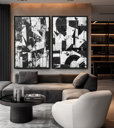 Urban Noir Bundle room mockup: two black-and-white geometric collage artworks, shown above a grey sofa.