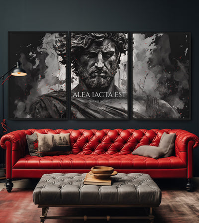 The Die Is Cast room mockup: a monochrome bearded classical figure with ALEA IACTA EST lettering, shown as a three-panel version above a red sofa.