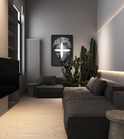 Addition room mockup: monochrome classical head crossed by a white plus sign, shown on a living-room wall beside a cactus.