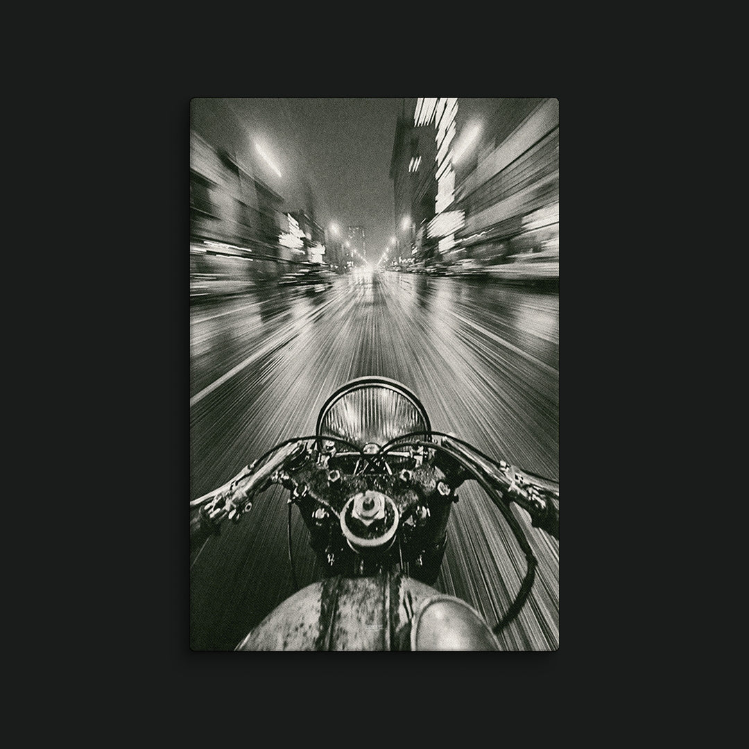 Rush first-person motorcycle canvas wall art with handlebars and a blurred night city