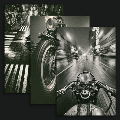 Built to Vanish Collection artwork view: three monochrome motorcycle artworks showing a front wheel, rider-view cockpit and overhead street crossing.