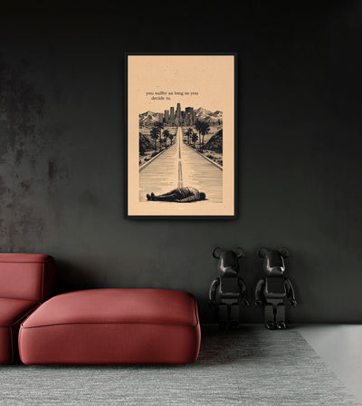 Suffering room mockup: a figure lying on a road toward a city, with YOU SUFFER AS LONG AS YOU DECIDE TO lettering on beige, shown above a red chaise.