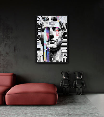 Broken Design room mockup: a fragmented monochrome classical face interrupted by colored vertical strips and collage blocks, shown above a red chaise.