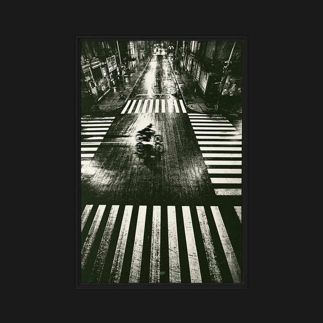 Framed Trace urban motorcycle print with a rider blurred across a rain-slicked city street