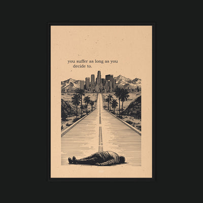 Suffering framed artwork view: a figure lying on a road toward a city, with YOU SUFFER AS LONG AS YOU DECIDE TO lettering on beige.