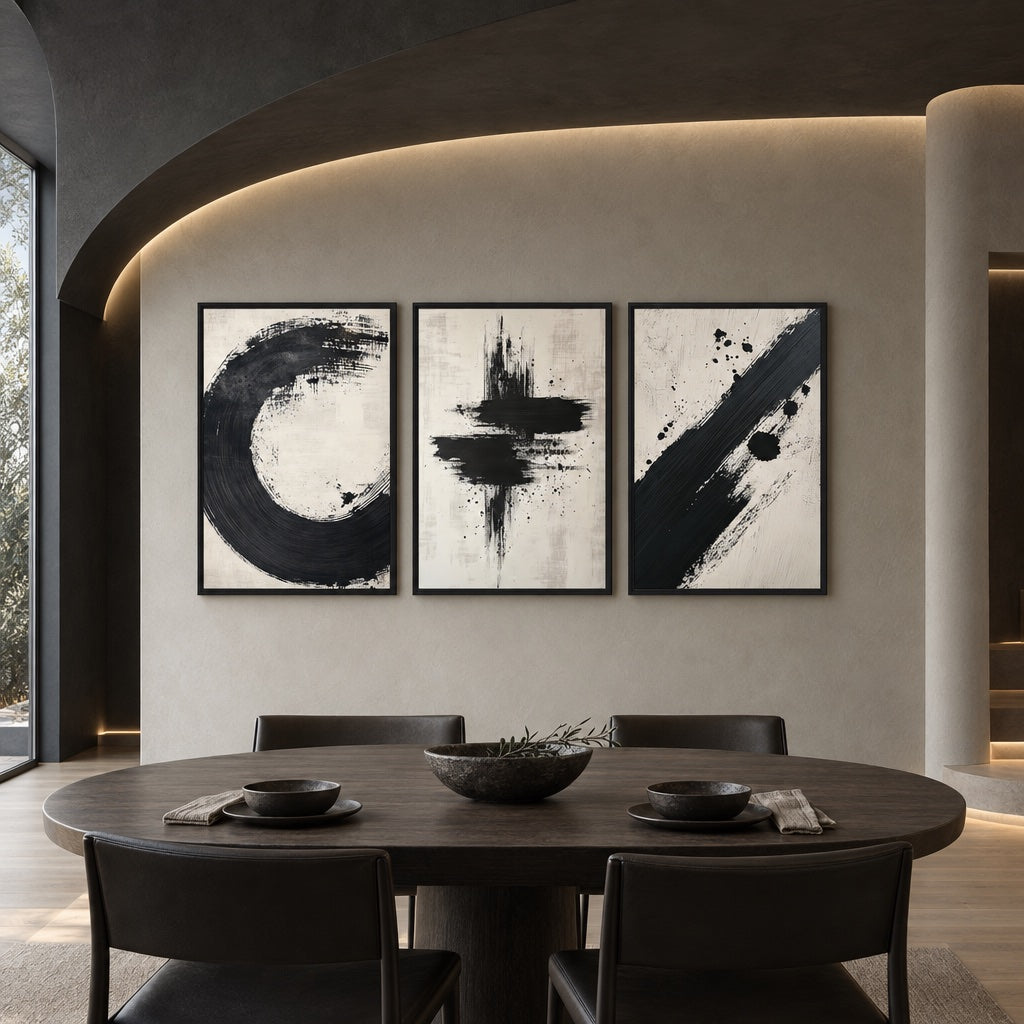 Three Ebb and Flow brushwork canvases above a round dining table in a neutral interior