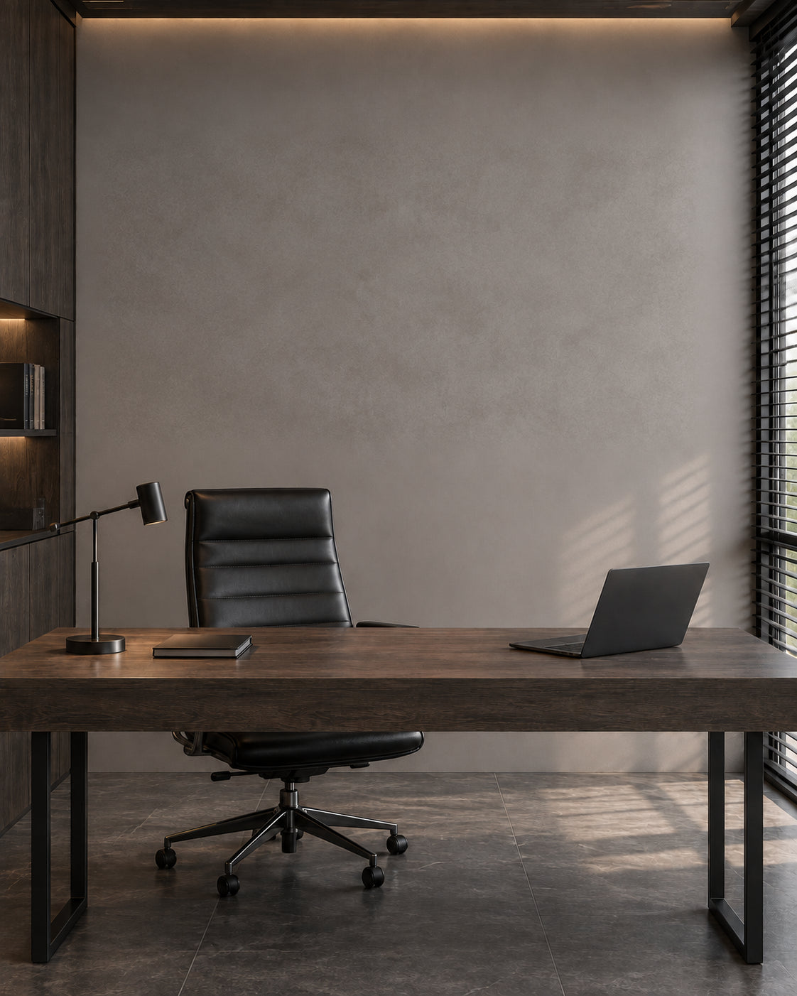 A home office with a smoked oak desk and an empty grey wall